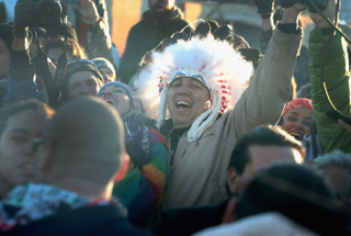 CANNON BALL, ND - DECEMBER 04: Native American and other activists celebrate after learning an easement had been denied for the Dakota Access Pipeline at Oceti Sakowin Camp on the edge of the Standing Rock Sioux Reservation on December 4, 2016 outside Cannon Ball, North Dakota. The US Army Corps of Engineers announced today that it will not grant an easement to the Dakota Access Pipeline to cross under a lake on the Sioux Tribes Standing Rock reservation, ending a months-long standoff.